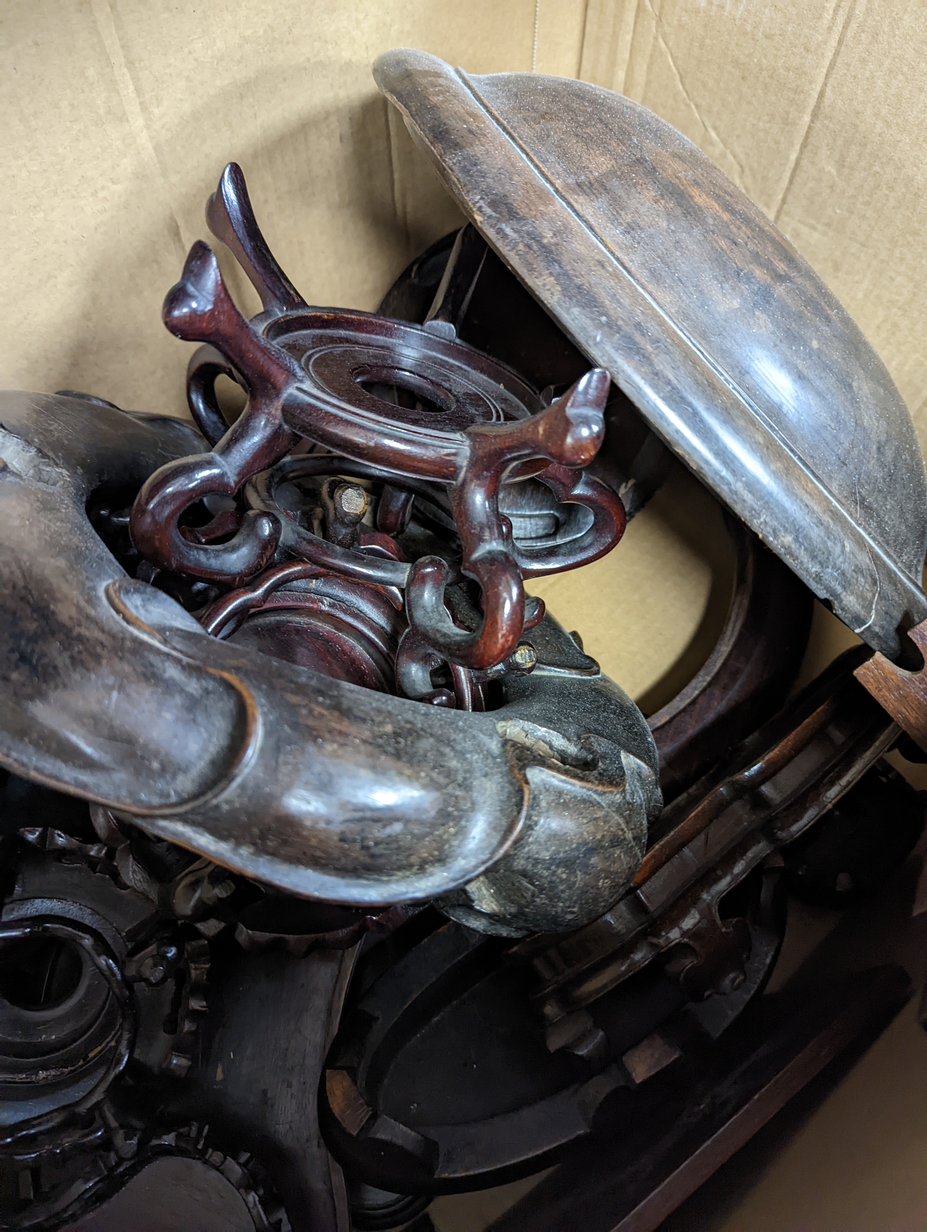 A quantity of Oriental carved wood stands